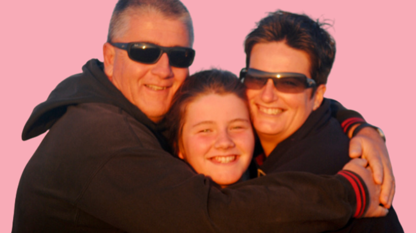 Jacqui de Kort, her husband Paul and their daughter, Alana smile and share a group hug.