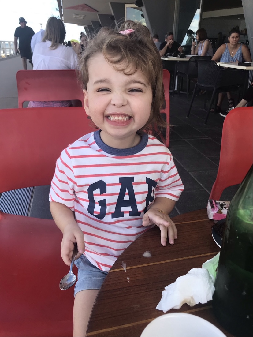 Adelaide Tonkin, more recently, sitting at an outdoor cafe dining area