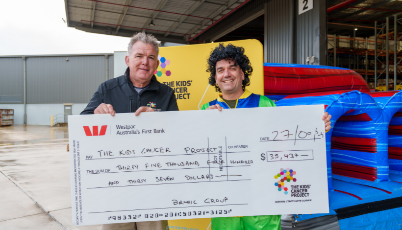 The Kids' Cancer Project CEO, Owen Finegan (centre), accepting a cheque from Bromic managing director, Scott Smith (right).