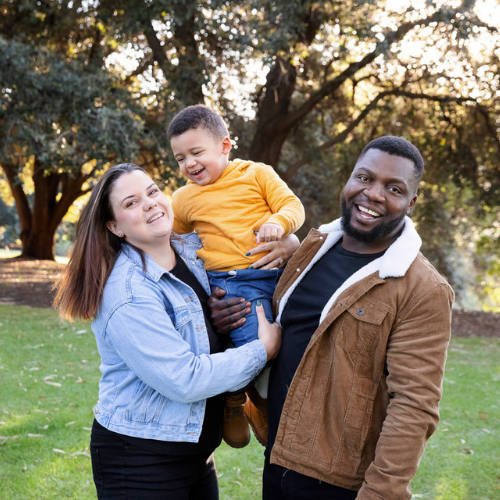 CJ, Chrizette and Callisto smile for the camera in a lovely family portrait.