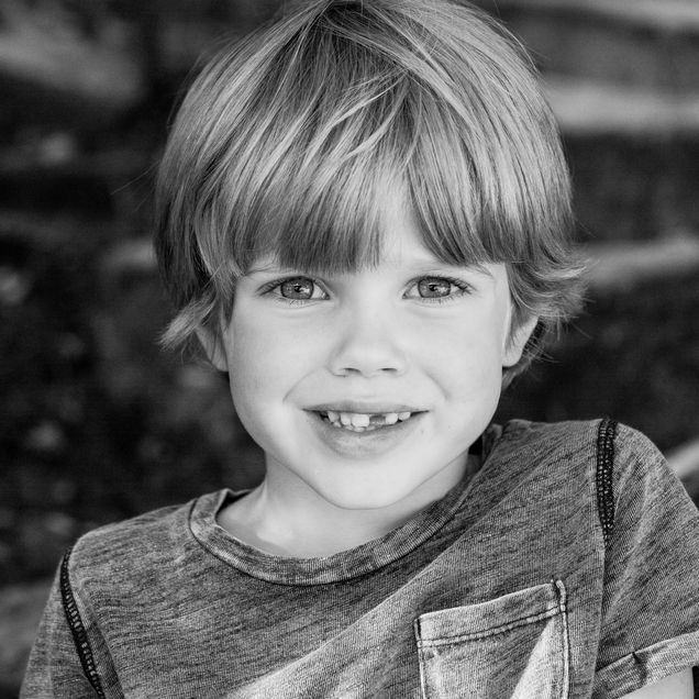 Black and white headshot of Murray smiling at the camera