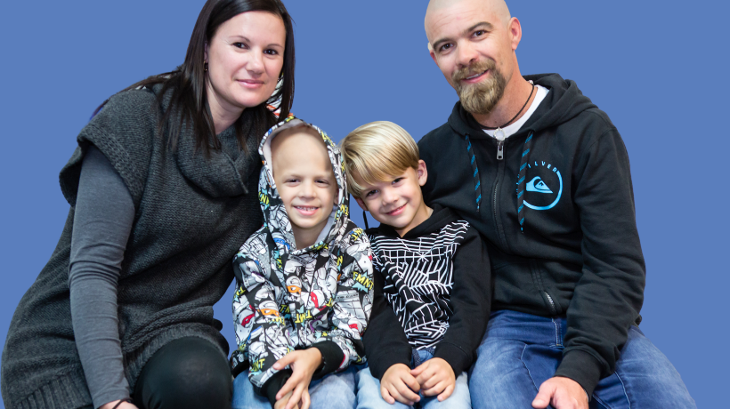 Declan with his little brother Brodie and his mum and dad.