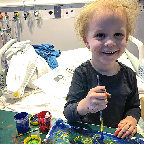 Bradley in hospital doing some painting