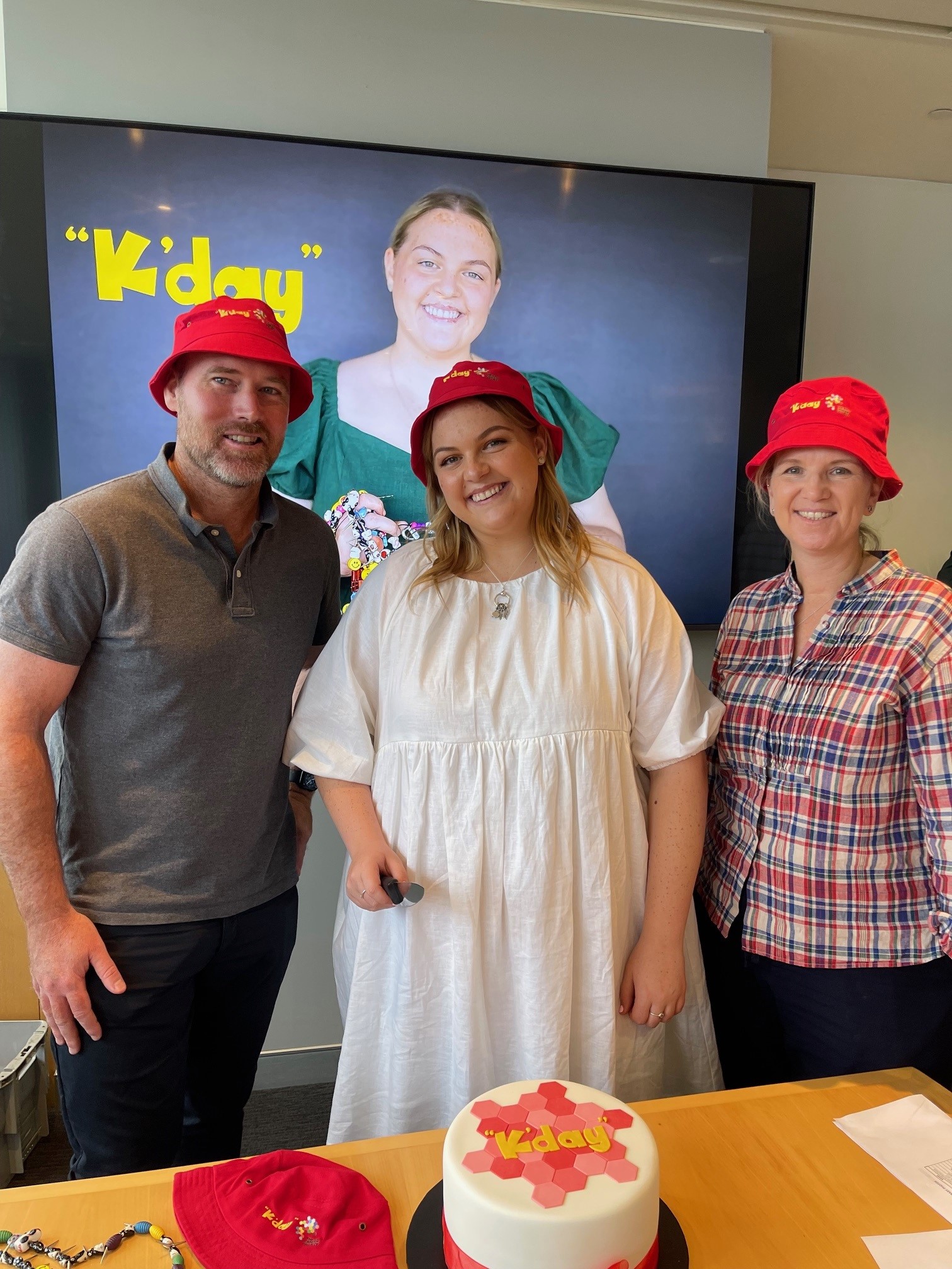 Preparing to cut the K'Day cake with sarcoma survivor Molly Croft