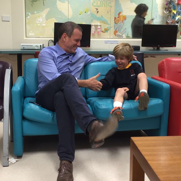 Murray playing with his dad Doug at the hospital